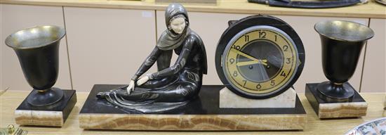 A Deco bronzed metal figural clock garniture